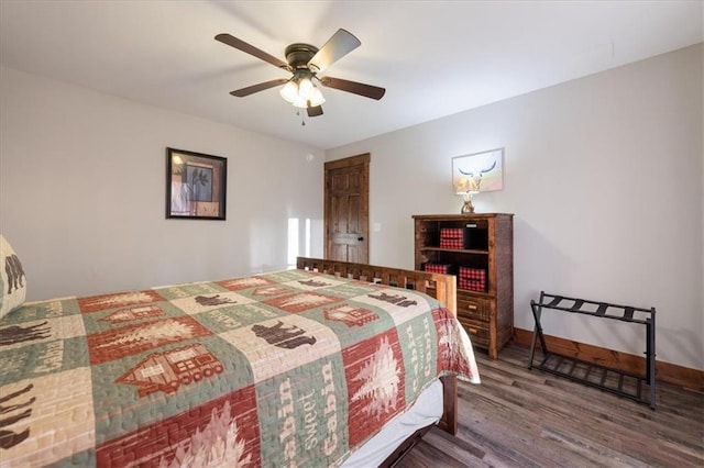 bedroom with ceiling fan and hardwood / wood-style floors