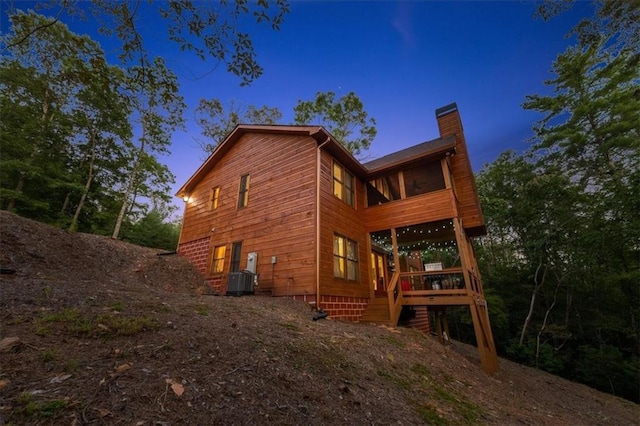 property exterior at dusk with a deck