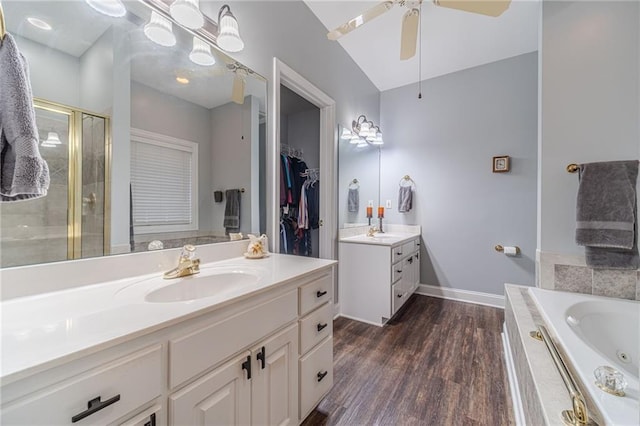 bathroom featuring vanity, shower with separate bathtub, wood-type flooring, and ceiling fan