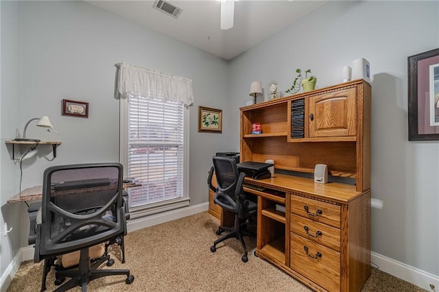 carpeted office featuring ceiling fan