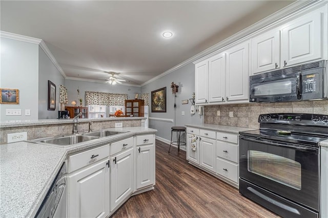 kitchen with sink, dark wood-type flooring, black appliances, white cabinets, and decorative backsplash