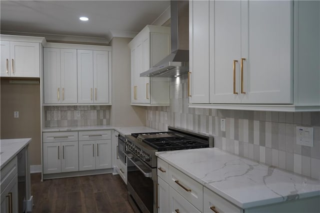 kitchen with white cabinets, wall chimney exhaust hood, dark wood-style floors, and high end stainless steel range