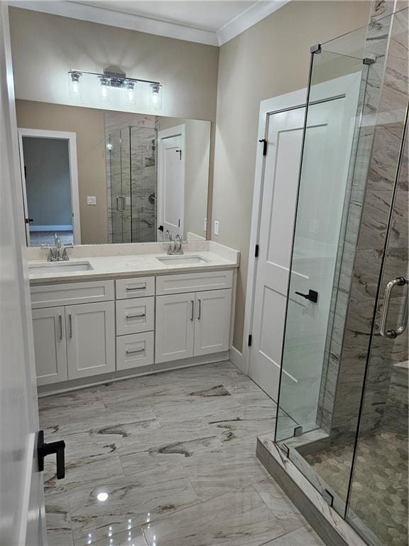 bathroom featuring a sink, ornamental molding, double vanity, and a stall shower