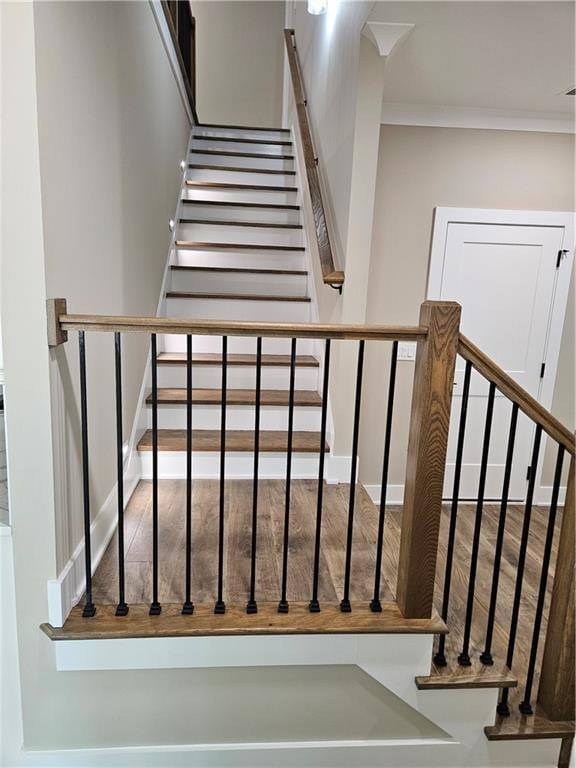 staircase with crown molding
