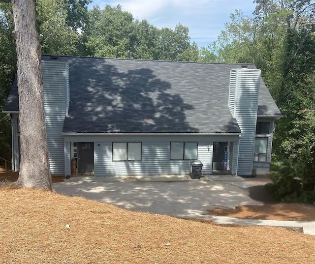 rear view of property featuring a patio area