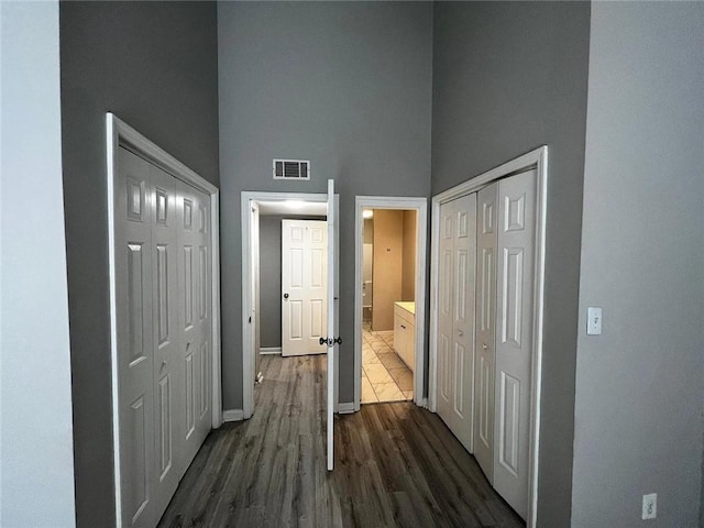 3932 Darryl Ln, Gainesville, GA 30506 - hall with visible vents, baseboards, a high ceiling, and dark wood-style floors