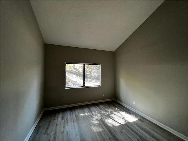 3932 Darryl Ln, Gainesville, GA 30506 - empty room with vaulted ceiling, baseboards, and wood finished floors