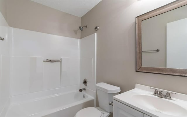 bathroom featuring tub / shower combination, a textured ceiling, toilet, and vanity