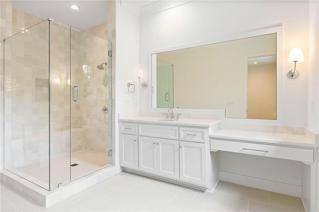 bathroom featuring vanity, tile patterned floors, and a shower with shower door