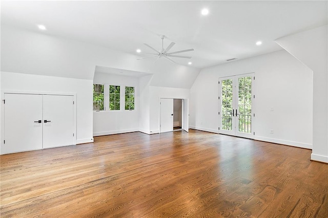 additional living space with wood-type flooring, vaulted ceiling, and ceiling fan