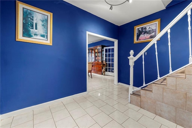 entryway with tile patterned floors