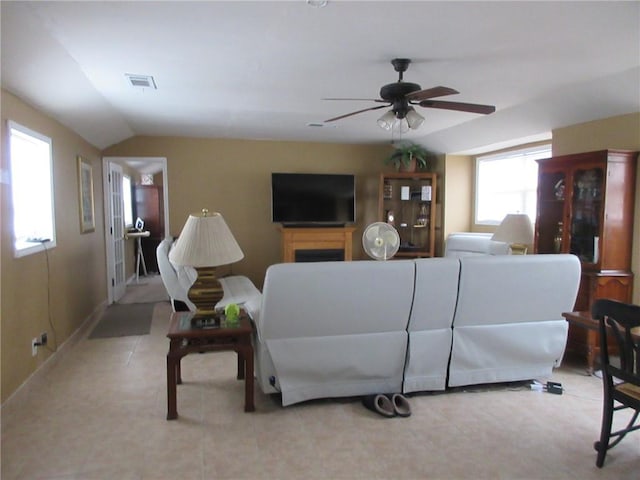 living room featuring lofted ceiling and ceiling fan