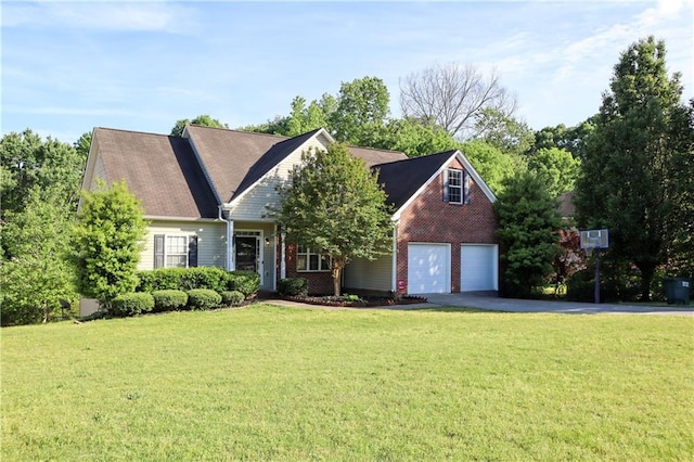 view of front of property featuring an attached garage, a front yard, brick siding, and aphalt driveway