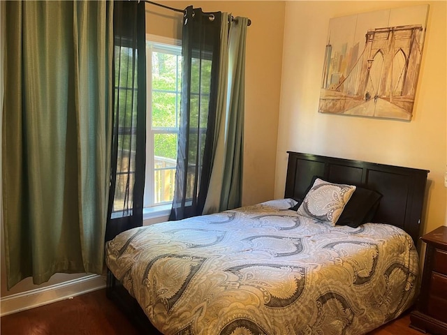 bedroom featuring wood finished floors