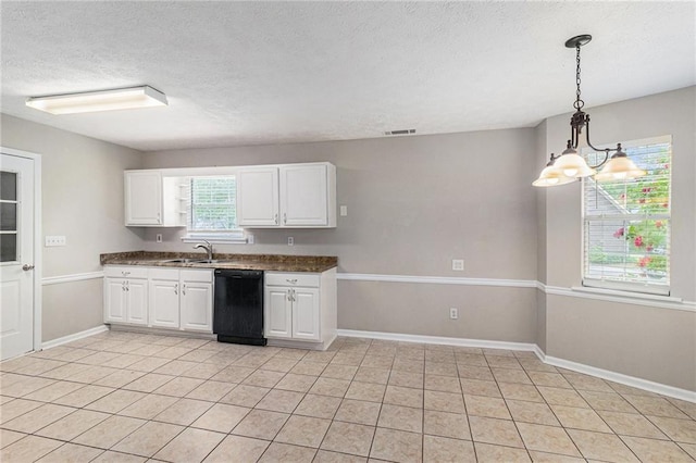kitchen with white cabinets, a sink, dishwasher, a textured ceiling, and visible vents