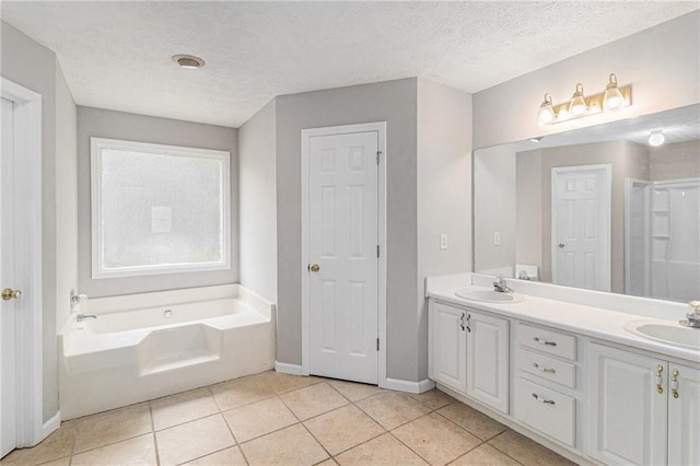 full bath with baseboards, a sink, and tile patterned flooring