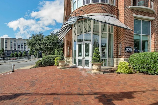 325 E Paces Ferry Rd NE Unit 1910, Atlanta, GA 30305 - entrance to property with french doors and brick siding