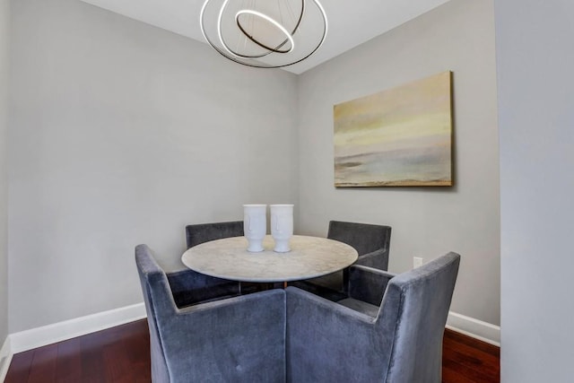 325 E Paces Ferry Rd NE Unit 1910, Atlanta, GA 30305 - dining room featuring baseboards and wood finished floors
