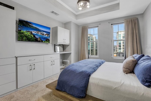 325 E Paces Ferry Rd NE Unit 1910, Atlanta, GA 30305 - bedroom with a raised ceiling, carpet flooring, and built in desk