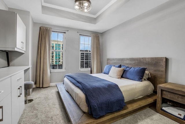 325 E Paces Ferry Rd NE Unit 1910, Atlanta, GA 30305 - bedroom featuring light colored carpet and a raised ceiling