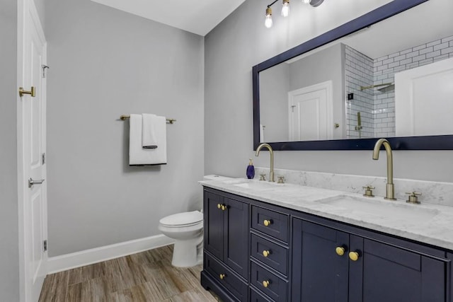 325 E Paces Ferry Rd NE Unit 1910, Atlanta, GA 30305 - full bath with double vanity, tiled shower, and wood finished floors