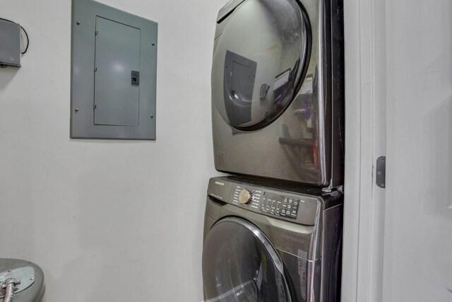 325 E Paces Ferry Rd NE Unit 1910, Atlanta, GA 30305 - laundry room with electric panel and stacked washing machine and dryer