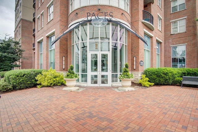 325 E Paces Ferry Rd NE Unit 1910, Atlanta, GA 30305 - view of exterior entry with french doors and brick siding