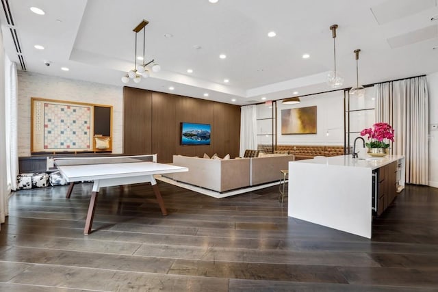 325 E Paces Ferry Rd NE Unit 1910, Atlanta, GA 30305 - living room featuring a tray ceiling, dark wood finished floors, and recessed lighting