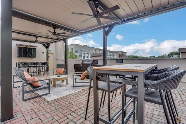 325 E Paces Ferry Rd NE Unit 1910, Atlanta, GA 30305 - view of patio featuring ceiling fan and outdoor dining space