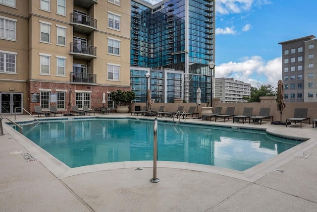 325 E Paces Ferry Rd NE Unit 1910, Atlanta, GA 30305 - community pool featuring a patio area