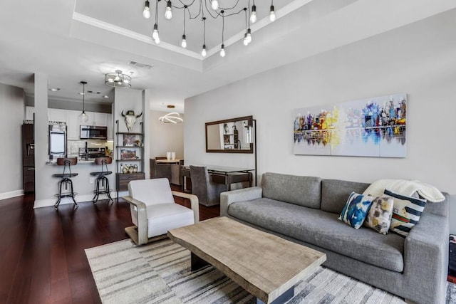 325 E Paces Ferry Rd NE Unit 1910, Atlanta, GA 30305 - living area with wood-type flooring, a raised ceiling, and a chandelier