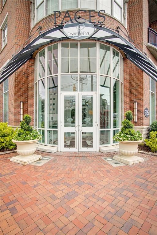 325 E Paces Ferry Rd NE Unit 1910, Atlanta, GA 30305 - entrance to property with french doors and brick siding