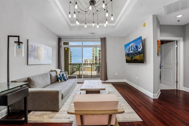 325 E Paces Ferry Rd NE Unit 1910, Atlanta, GA 30305 - living room featuring a tray ceiling, track lighting, hardwood / wood-style flooring, and a chandelier