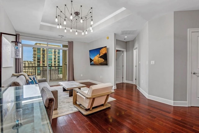 325 E Paces Ferry Rd NE Unit 1910, Atlanta, GA 30305 - living room featuring a tray ceiling, hardwood / wood-style flooring, and a chandelier