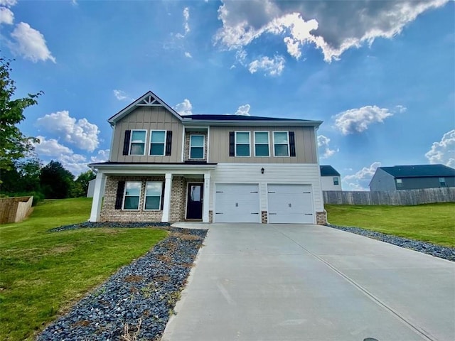 view of front facade with a front yard and a garage