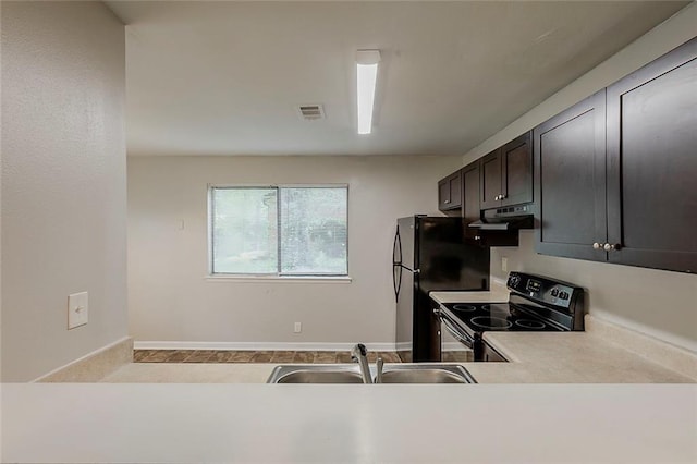 6200 Beaver Creek Trl, Atlanta, GA 30349 - kitchen featuring range with electric stovetop, exhaust hood, and light countertops