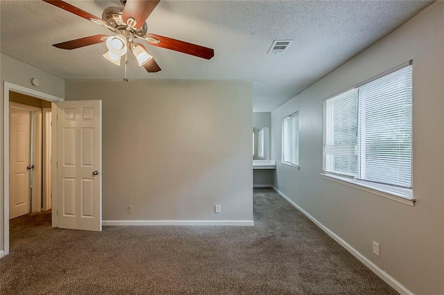 6200 Beaver Creek Trl, Atlanta, GA 30349 - spare room with a textured ceiling, carpet, and a ceiling fan