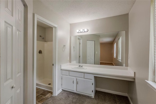 6200 Beaver Creek Trl, Atlanta, GA 30349 - bathroom with a shower stall, vanity, and a textured ceiling