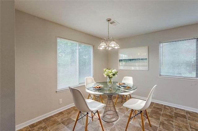 6200 Beaver Creek Trl, Atlanta, GA 30349 - dining room with a chandelier and baseboards