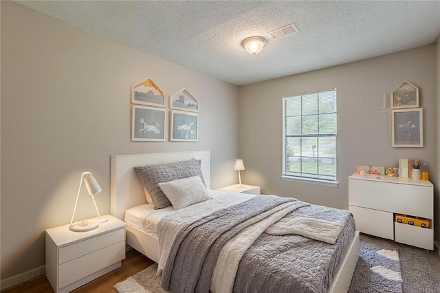 6200 Beaver Creek Trl, Atlanta, GA 30349 - bedroom featuring a textured ceiling and baseboards