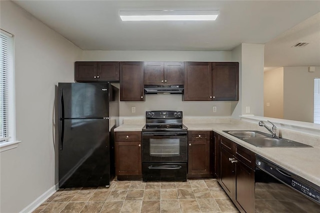 6200 Beaver Creek Trl, Atlanta, GA 30349 - kitchen featuring black appliances, range hood, light countertops, and dark brown cabinetry