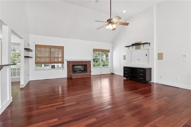 4046 Water Hole Ct, Douglasville, GA 30135 - unfurnished living room featuring high vaulted ceiling, a ceiling fan, wood finished floors, and a brick fireplace