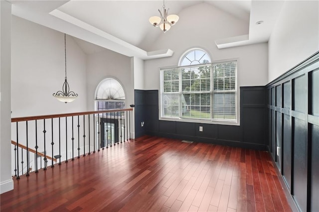 4046 Water Hole Ct, Douglasville, GA 30135 - empty room featuring a chandelier, hardwood / wood-style floors, and high vaulted ceiling