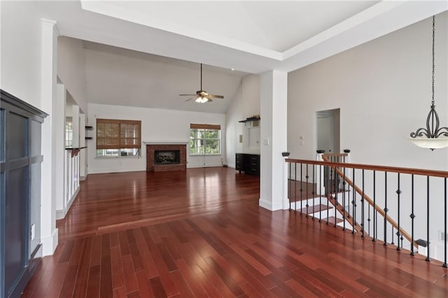 4046 Water Hole Ct, Douglasville, GA 30135 - unfurnished living room with ceiling fan, a fireplace, wood finished floors, and high vaulted ceiling