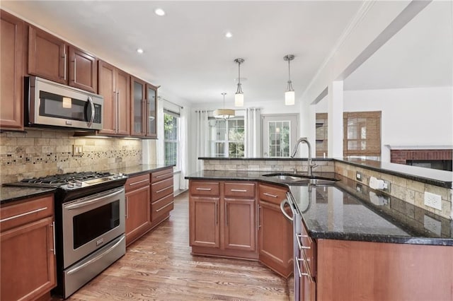 4046 Water Hole Ct, Douglasville, GA 30135 - kitchen with appliances with stainless steel finishes, tasteful backsplash, light wood-style floors, recessed lighting, and crown molding