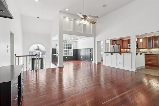 4046 Water Hole Ct, Douglasville, GA 30135 - unfurnished living room featuring ceiling fan, high vaulted ceiling, hardwood / wood-style flooring, a chandelier, and recessed lighting