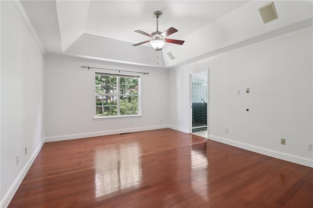 4046 Water Hole Ct, Douglasville, GA 30135 - spare room with a tray ceiling, ceiling fan, wood finished floors, and ornamental molding