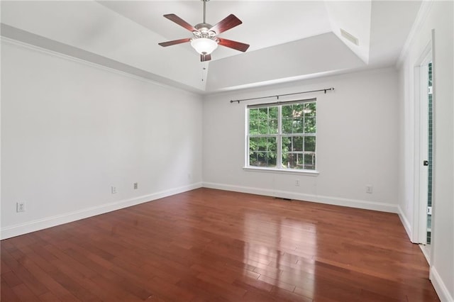4046 Water Hole Ct, Douglasville, GA 30135 - empty room featuring a tray ceiling, ceiling fan, wood finished floors, and ornamental molding