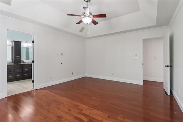 4046 Water Hole Ct, Douglasville, GA 30135 - unfurnished bedroom featuring hardwood / wood-style floors, a raised ceiling, crown molding, ensuite bath, and a ceiling fan
