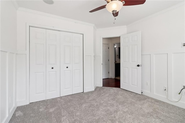 4046 Water Hole Ct, Douglasville, GA 30135 - unfurnished bedroom with carpet, ornamental molding, a decorative wall, a closet, and wainscoting
